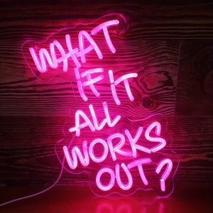 ‘What If It All Works Out?’ pink neon light wall decor by Money Duvet — USB-powered motivational LED sign on wood wall.